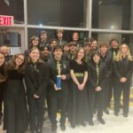 photo of jazz ensemble with trophy at state finals