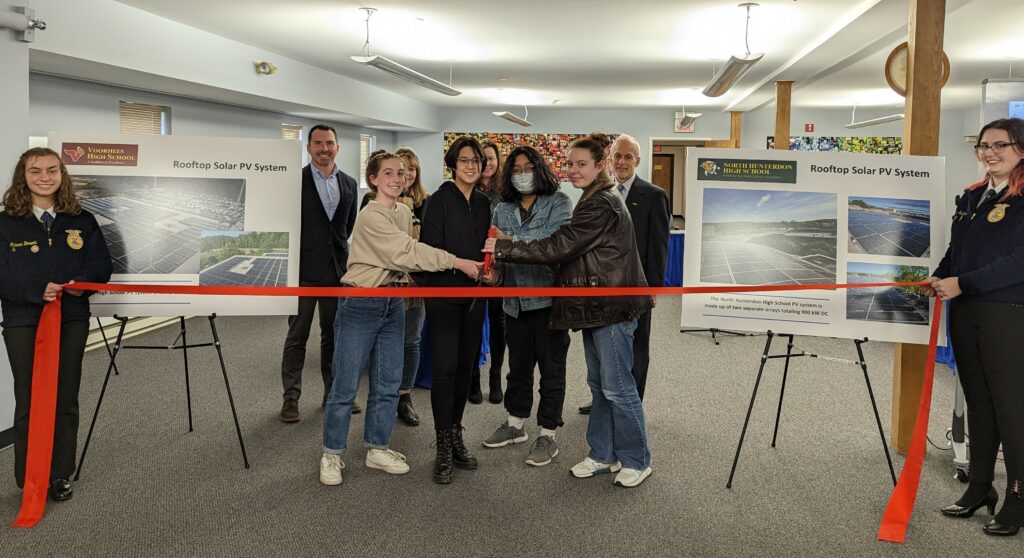 photo of students cutting ribbon